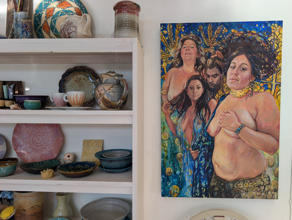Shelf with ceramic plates and bowls, featuring a painting of a woman on the wall.
